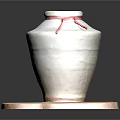 White Ceramic Jar With Red Ribbon On Irregular Wooden Base Against Dark Background