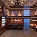 Elegant Wedding Dress Shop Interior Featuring Chandelier And Displayed Wedding Dresses On Counter