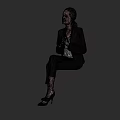 Woman in Black Blazer White Top Black Pants with Clasped Hands Sitting Against Dark Background