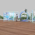 Floral Display With Circular Structure Glass Partitions Green Plants And Brand Logo On Wooden Flooring