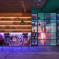 Modern Bar Interior With Anime Posters High Stools And Illuminated Shelves 3d model