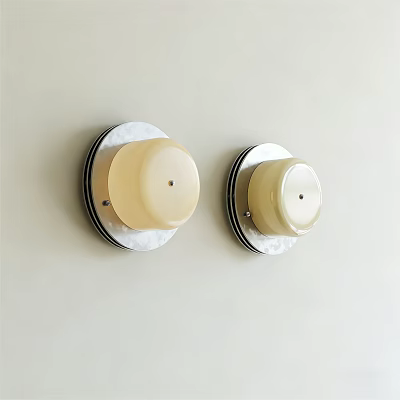 Two Minimalist Wall Sconces With Cream Lampshade And Round Base On Light Colored Wall 3d model