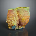 Brightly Colored Marine Sponge With Yellow Green And Orange Textured Surface In Ocean