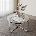 Modern Glass Top Coffee Table with Metal Frame Open Book Vase Statue on Rug