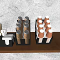 Brown Paper Cups With White Lids And Gold Accents In Black Organizers On Wooden Tabletop