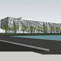Modern Geometric Building With Glass Curtain Wall And Trees Along Roadside