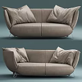 Beige Leather Two Seater Sofa With Rivet Details And Soft Cushions