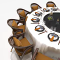 Round Dining Table Set With Wicker Chairs Brown Cushioned Seats White Tablecloth Wine Glasses Tableware