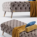 Tufted Gray Sofa Bench With Gold Legs Yellow Blanket And Blue Cushion