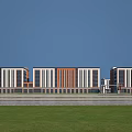 Industrial Factory Building Exterior With Orange White Stripes Large Glass Windows Grassland And Blue Sky