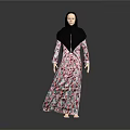 Woman in Floral Dress and Black Hijab Standing Against Gray Background