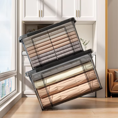 Neatly Folded Clothes Of Various Colors In Transparent Storage Bins At Home 3d model