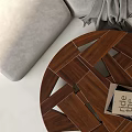 Modern Wooden Coffee Table With Geometric Interlocking Design Grey Sofa And Book On Top