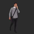 Man In Gray Sweater With White Shirt Collar Talking On Phone In Dark Gray Background
