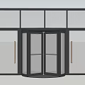 Modern Revolving Door With Glass Panels And Surrounding Glass Facade For Commercial Entrance
