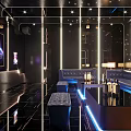 Modern KTV Lounge Interior With Blue Lighting Large TV Screen Mirrored Walls And Sofas 3d model