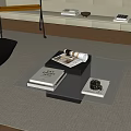 Modern Glass Coffee Table On Rug With Books Cup And Black Chair In Living Room