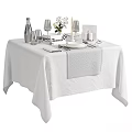 Elegant Dinnerware Set with Plates Glassware Reserved Sign and Flower Vase on White Tablecloth