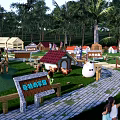 Fun Children's Playground With Wooden Fences Yellow Duck Statue Tents Trees And Green Lawn
