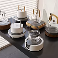 Modern Kitchen Electric Kettles With Various Designs Glass Bodies And Wooden Handles On Black Countertop