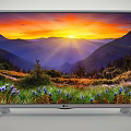 LG TV Displaying Beautiful Sunset Over Mountain Meadow With Purple Flowers