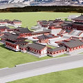 Ancient Chinese Architecture with Traditional Roofs Red Walls and Surrounding Green Grassland Against Distant Mountains
