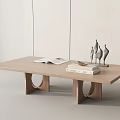Modern Minimalist Wooden Coffee Table With Circular Legs Open Book Stacked Books And Decor Sculptures