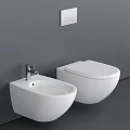 Modern Wall Mounted White Toilet With Matching Bidet Against Gray Wall In Contemporary Bathroom