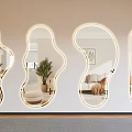 Modern Irregular Shaped Wall Mirrors with LED Light Edges Reflecting Living And Dining Room Scenes