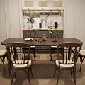 Dark Wooden Dining Table Set With Four Chairs Vase Book And Green Cabinets