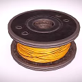 Black Spool With Yellow Wound Wire And Circular Design Holes On Surface 3d model