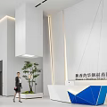 Modern Office Reception Area Design With White And Blue Geometric Counter And Green Plant