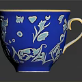 Blue Ceramic Cup With Orange Interior And Gold Handle Floral Patterns