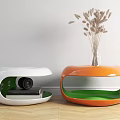 Modern Curved White And Orange Bedside Tables With Camera Books Vase And Dried Grass