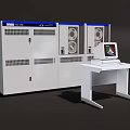 Computer System With Monitor On White Table And Equipment Cabinets