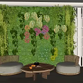 Casual Sofa Set Featuring Rattan Seats Round Coffee Table And Lush Green Plant Wall
