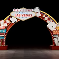 Illuminated Las Vegas Welcome Arch With Playing Cards Dice Motel Signs And Checkered Decorations