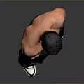 A Shirtless Muscular Man In Dark Cargo Pants And Black White Sneakers Against Grey Background