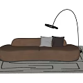 Modern Multi Person Brown Velvet Sofa With Gray White Pillows And Floor Lamp