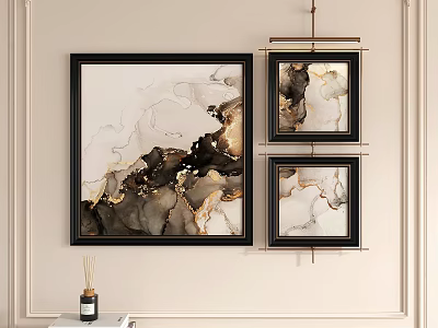 Black Framed Abstract Paintings with Black White and Gold Tones Hanging on Light Colored Wall 3d model