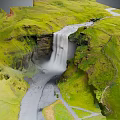 Stunning Green Valley Landscape With Waterfall Flowing River And Lush Grass