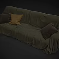 Comfortable Sectional Sofa with Green Slipcover and Brown Dark Accent Pillows