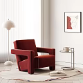 Red Velvet Armchair In Living Room With Floor Lamp Side Table And Wall Art