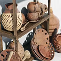 Ceramic Vessels with Various Handcrafted Designs Displayed on Wooden Shelf Including Teapots and Jars