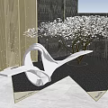 Modern Garden Ornament With Metallic Curved Sculpture Flowering Trees And Geometric Paving Design