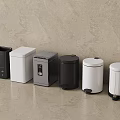 Modern Household Trash Bins In Various Colors And Sleek Designs Arranged On Neutral Background