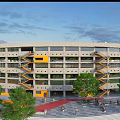 Modern Office Building Exterior With Yellow Accents Trees And Pedestrian Plaza