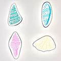 Four Colorful Decorative Shell Shaped Artworks With Diverse Patterns And Textures