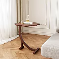 Petal Shaped Top Wooden Side Table By Light Gray Sofa On Herringbone Floor