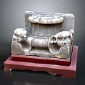 Ancient Stone Carved Capital With Decorative Animal Heads On Red Base